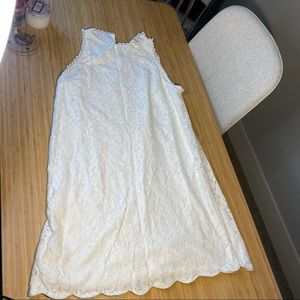 White lace dress with scalloped hem